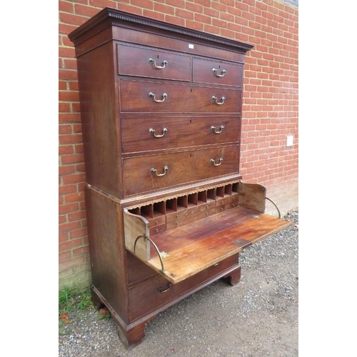 734 - A George III mahogany secretaire chest on chest, having a dentil cornice above two short over three ... 