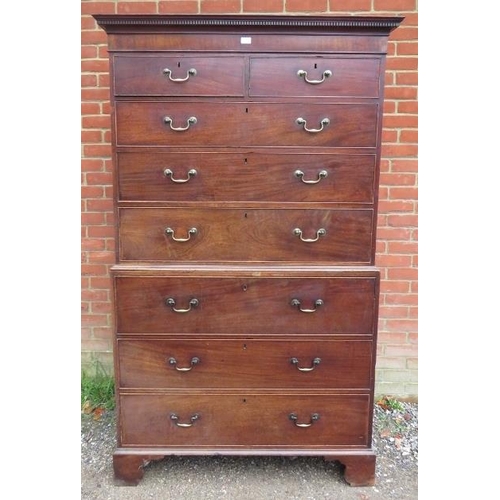 734 - A George III mahogany secretaire chest on chest, having a dentil cornice above two short over three ... 