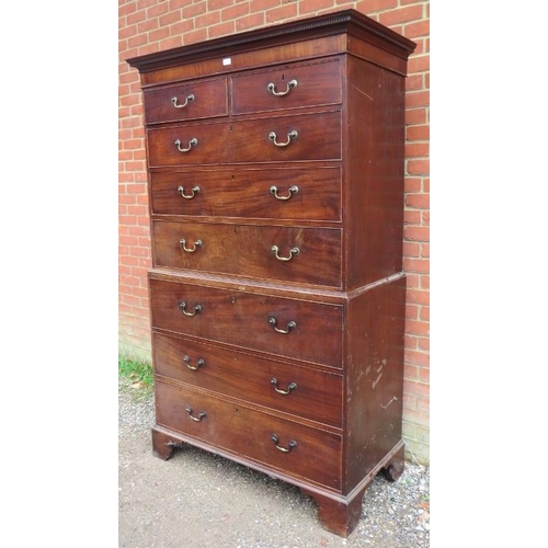 734 - A George III mahogany secretaire chest on chest, having a dentil cornice above two short over three ... 