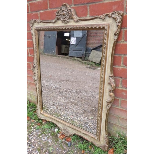 737 - A decorative period-style wall mirror, 20th century, relief moulded decoration, gilt and paint effec... 