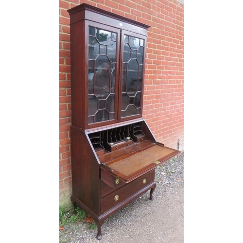 739 - An Edwardian mahogany bureau bookcase, having twin astral glazed doors enclosing adjustable shelves,... 