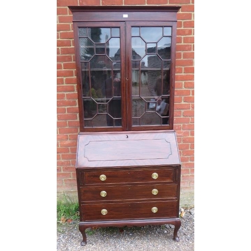 739 - An Edwardian mahogany bureau bookcase, having twin astral glazed doors enclosing adjustable shelves,... 