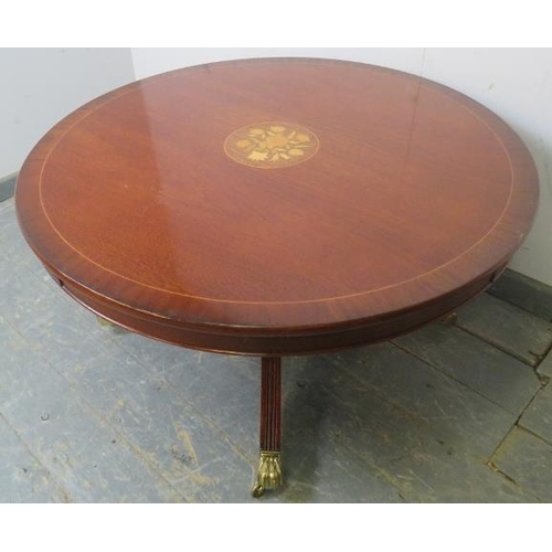 741 - A reproduction mahogany circular coffee table, crossbanded and having central marquetry inlaid panel... 