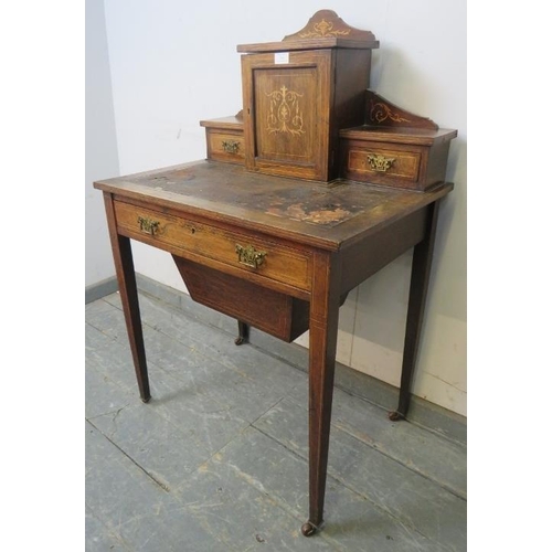 743 - An Edwardian rosewood ladies writing desk, having marquetry inlay and satinwood strung, the upper ga... 