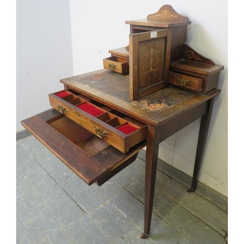 743 - An Edwardian rosewood ladies writing desk, having marquetry inlay and satinwood strung, the upper ga... 