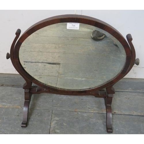 746 - An Edwardian mahogany oval swing dressing table mirror on splayed supports.
W49cm (approx).