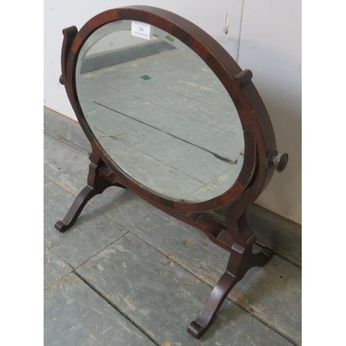 746 - An Edwardian mahogany oval swing dressing table mirror on splayed supports.
W49cm (approx).