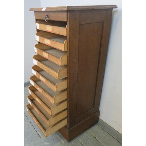 754 - An early 20th century oak tambour front pedestal cabinet, containing drawers, with key, pedestal bas... 