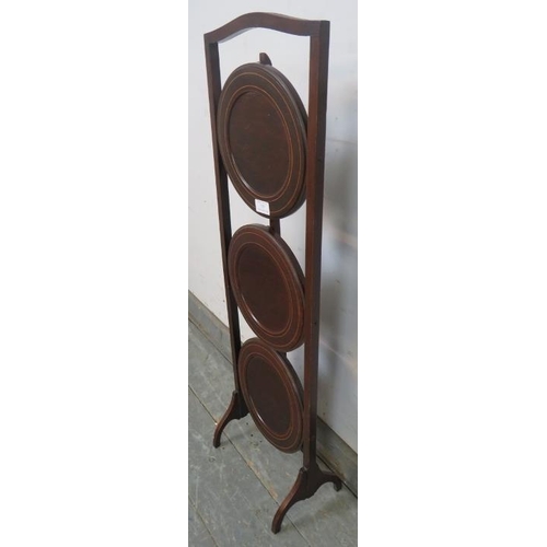 757 - An Edwardian boxwood strung mahogany three tier cake stand.
H90cm (approx).