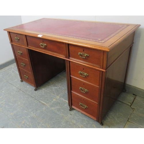 758 - An Edwardian mahogany child's pedestal desk, inset red leather top above configuration of 9 drawers ... 