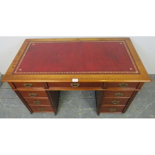 758 - An Edwardian mahogany child's pedestal desk, inset red leather top above configuration of 9 drawers ... 