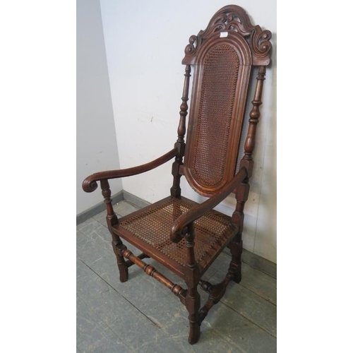 762 - An antique and later oak open-sided armchair in the William & Mary style, with caned seat and back p... 