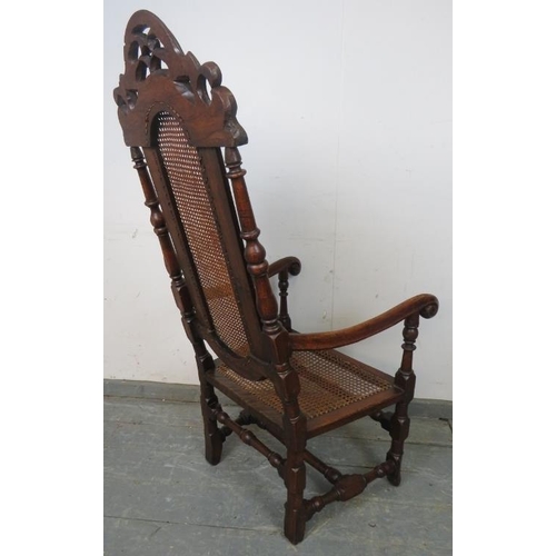 762 - An antique and later oak open-sided armchair in the William & Mary style, with caned seat and back p... 