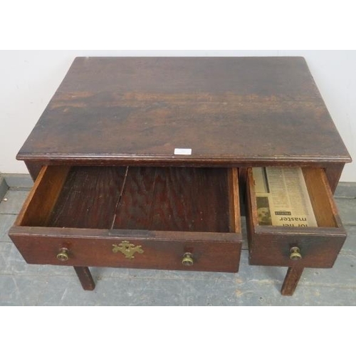 763 - An 18th century oak lowboy with one long drawer, raised on inner chamfered legs, some repairs and re... 