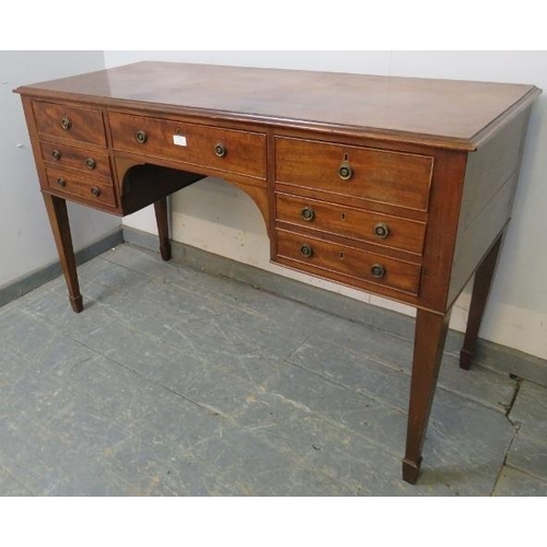 767 - A 19th century mahogany kneehole dressing table/desk, the configuration of cock-beaded drawers above... 