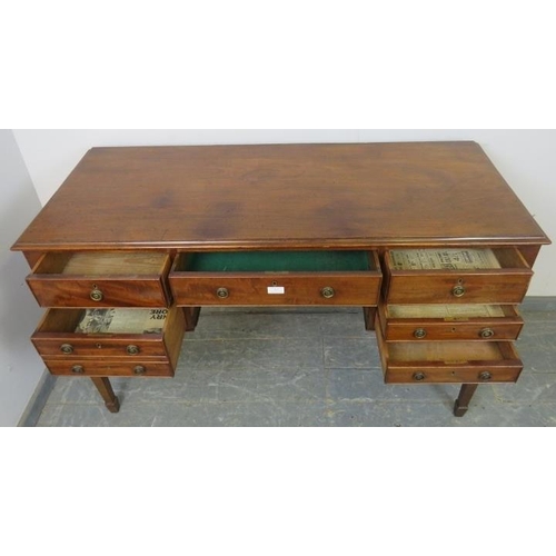 767 - A 19th century mahogany kneehole dressing table/desk, the configuration of cock-beaded drawers above... 