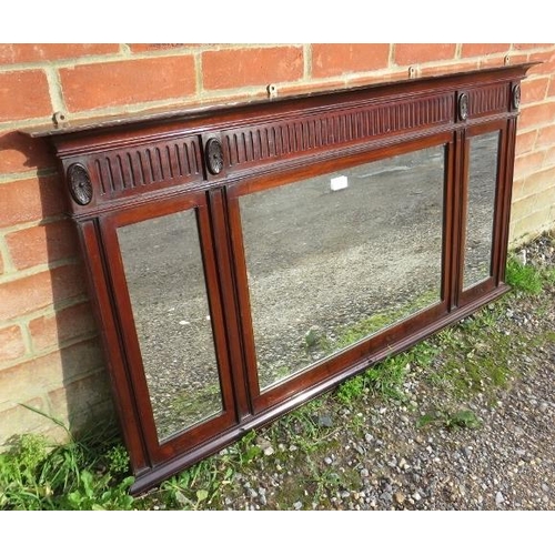 772 - An Edwardian mahogany over mantle mirror, inset with three bevelled plates, decorated throughout in ... 