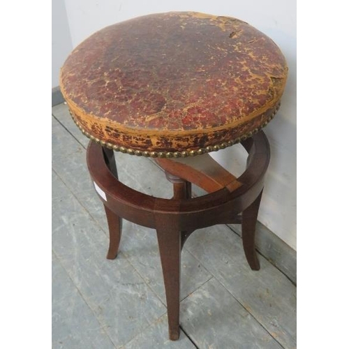 776 - A Victorian mahogany music stool, with circular height adjustable seat, (a/f).