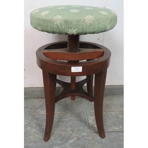 776 - A Victorian mahogany music stool, with circular height adjustable seat, (a/f).