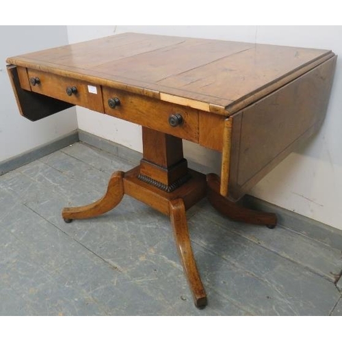 777 - An English Regency Period mahogany sofa table inlaid with ebony stringing, faded patination, two dra... 