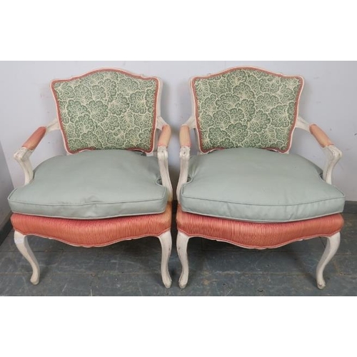 784 - A pair of French Louis XV revival open sided armchairs, 20th century, upholstered backs and seats, p... 