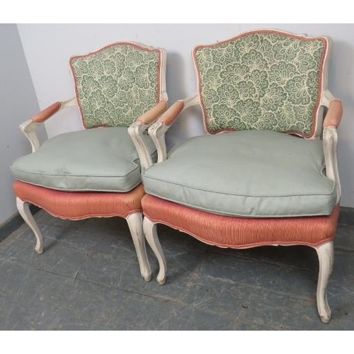 784 - A pair of French Louis XV revival open sided armchairs, 20th century, upholstered backs and seats, p... 