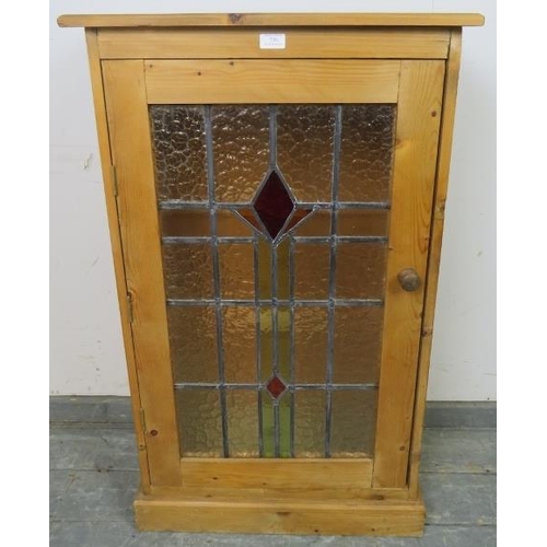 786 - A period-style stripped pine side cupboard, illuminated interior, glass shelves enclosed by stained ... 