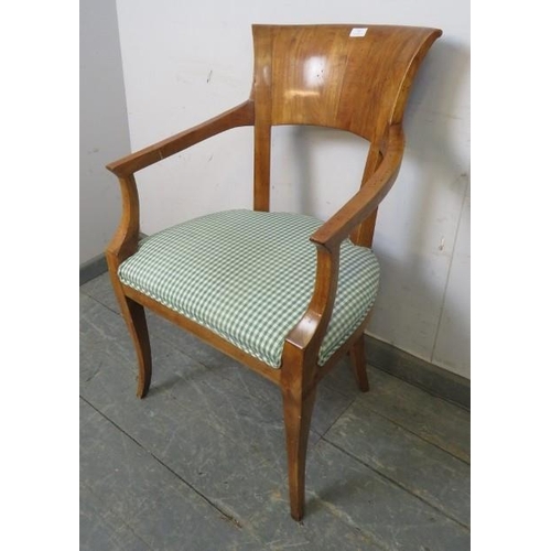 787 - An Empire style fruitwood open-sided armchair, upholstered seat.