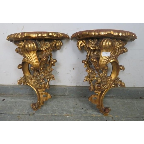 788 - A pair of ornate decorative period-style wall brackets, 20th century.
44cm (approx).