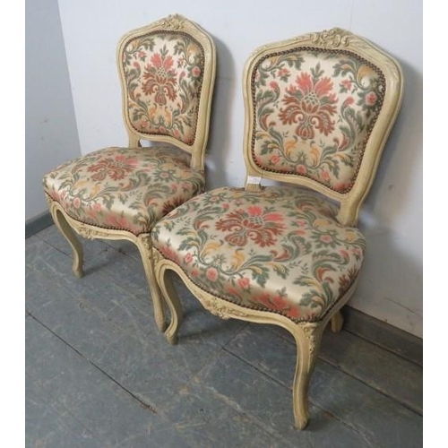 791 - A pair of vintage French side chairs in the Louis XV style, cream painted carved wood frames, classi... 