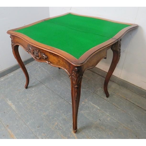 793 - A good 19th century figured walnut serpentine fronted card table, with carved decoration, rear slidi... 