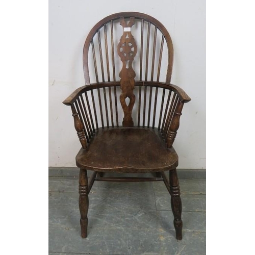 796 - An early 20th century elm & beech wheel-back Windsor armchair.