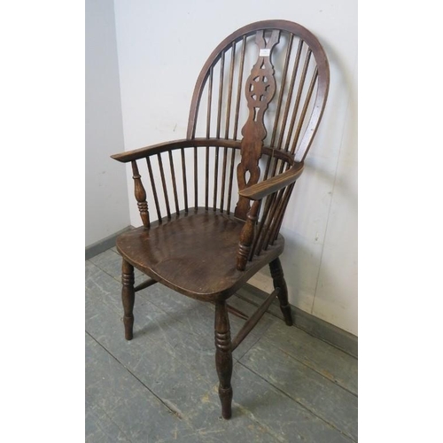 796 - An early 20th century elm & beech wheel-back Windsor armchair.