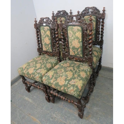 799 - A set of four 19th century Carolean Revival carved oak dining chairs, with busy foliate decoration, ... 