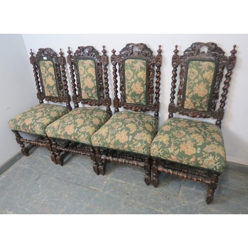 799 - A set of four 19th century Carolean Revival carved oak dining chairs, with busy foliate decoration, ... 