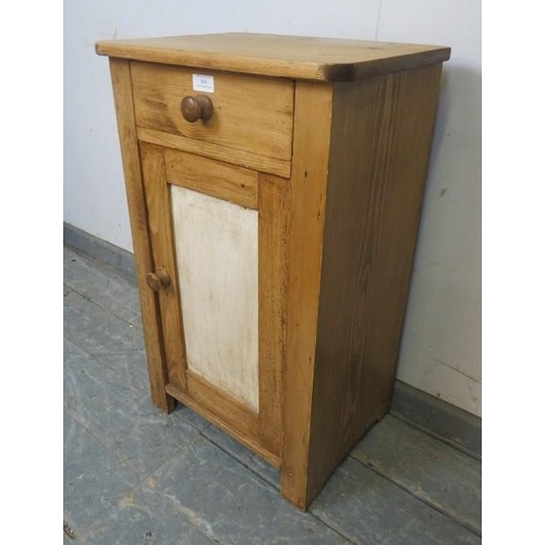 804 - A vintage stripped pine bedside cabinet, single drawer above panelled cupboard door, 45cm wide x 74c... 