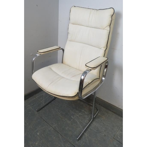 806 - A vintage mid-century desk chair in the manner of Pieff, upholstered in white leather with black pip... 