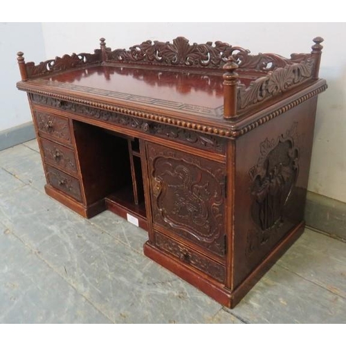 807 - A vintage Japanese lacquered carved wooden table top cabinet in the form of a grand desk, carved and... 