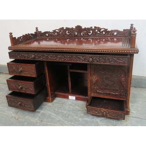 807 - A vintage Japanese lacquered carved wooden table top cabinet in the form of a grand desk, carved and... 