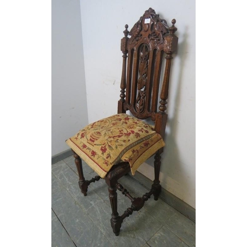 809 - A 19th century Carolean Revival carved oak single chair/hall chair, with caned seat and machined tap... 