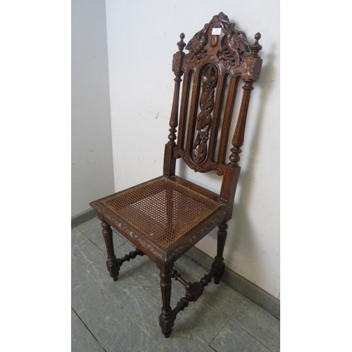 809 - A 19th century Carolean Revival carved oak single chair/hall chair, with caned seat and machined tap... 