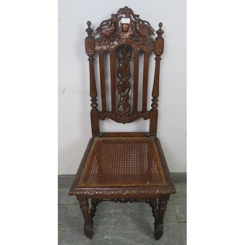 809 - A 19th century Carolean Revival carved oak single chair/hall chair, with caned seat and machined tap... 