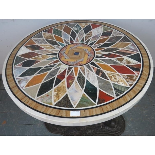 811 - A good quality highly decorative Regency style circular specimen marble table on a figural bronze ba... 