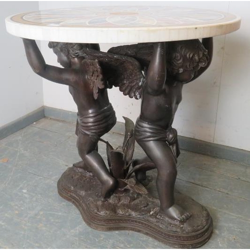 811 - A good quality highly decorative Regency style circular specimen marble table on a figural bronze ba... 