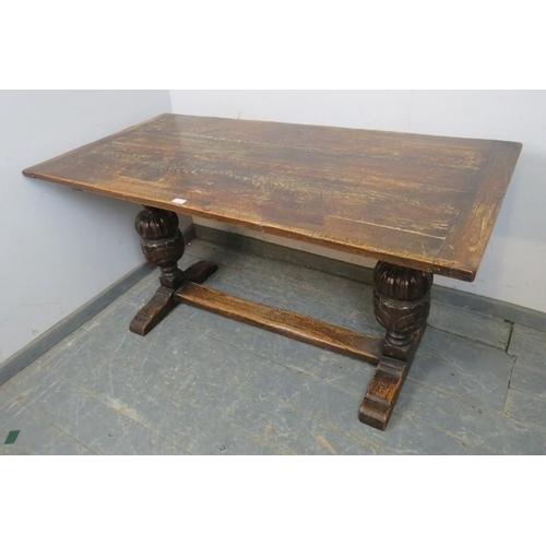 815 - An early 20th century Elizabethan revival carved oak refectory/dining table rectangular top above so... 