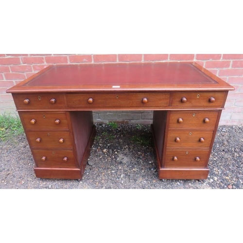 816 - A 19th century walnut pedestal desk, having inset gilt tooled burgundy leather surface, housing a co... 