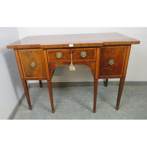 818 - An elegant George III satinwood banded mahogany breakfront sideboard, the central frieze drawer flan... 