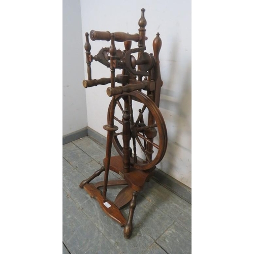 823 - A vintage fruitwood spinning wheel in the 18th century style, 45cm high.