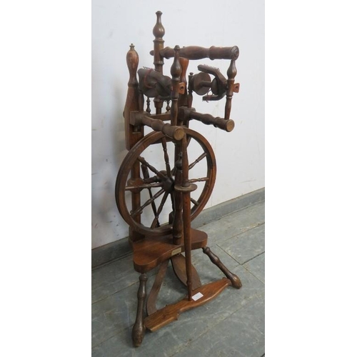 823 - A vintage fruitwood spinning wheel in the 18th century style, 45cm high.