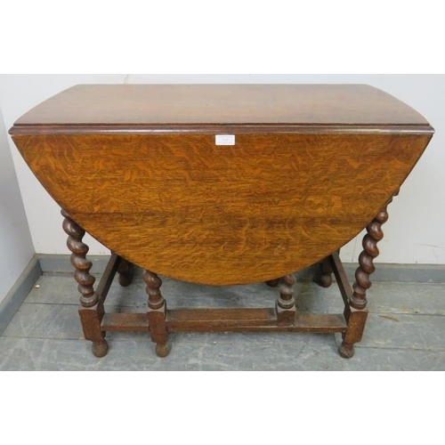 828 - An antique oak oval gate-leg table of small proportions, on barley twist supports with stretchers. 
... 